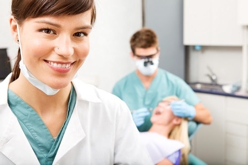 female hygienist in the foreground